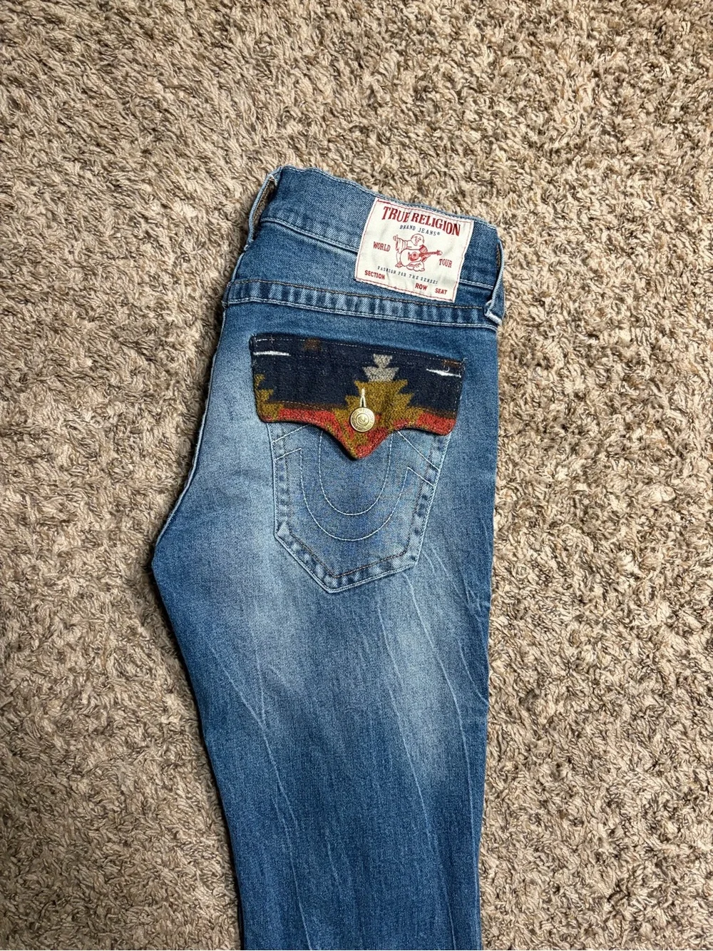 True Religion Men’s Blue Jeans with Multicolor Aztec Pocket Flaps